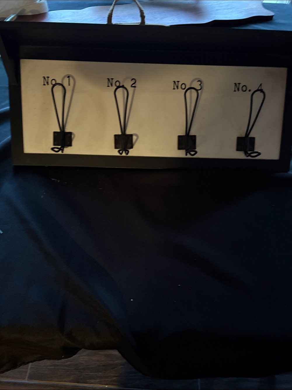 Wall-Mounted Numbered Hook Rack in Black and White